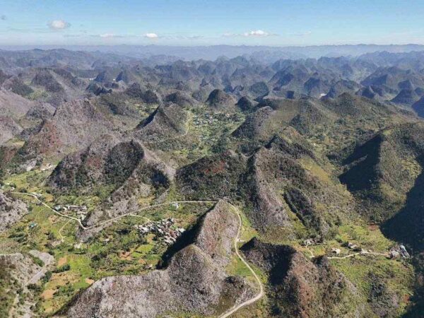 Panoramic view of Dong Van Karst Plateau Geopark with rugged limestone mountains and deep valleys
