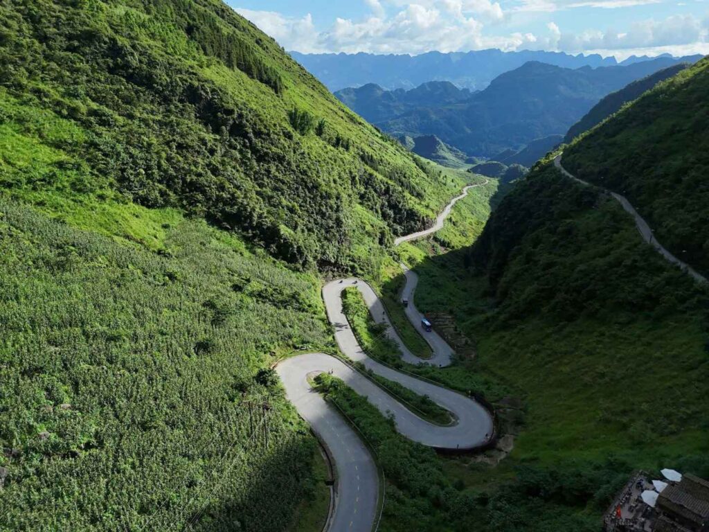 Aerial view of Tham Ma Pass winding road in Ha Giang Loop