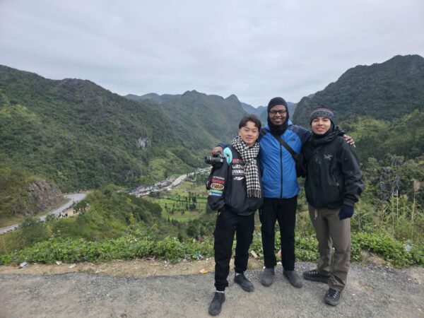 Hmong guide and tourist riding a motorbike on the 3-day Ha Giang Loop tour